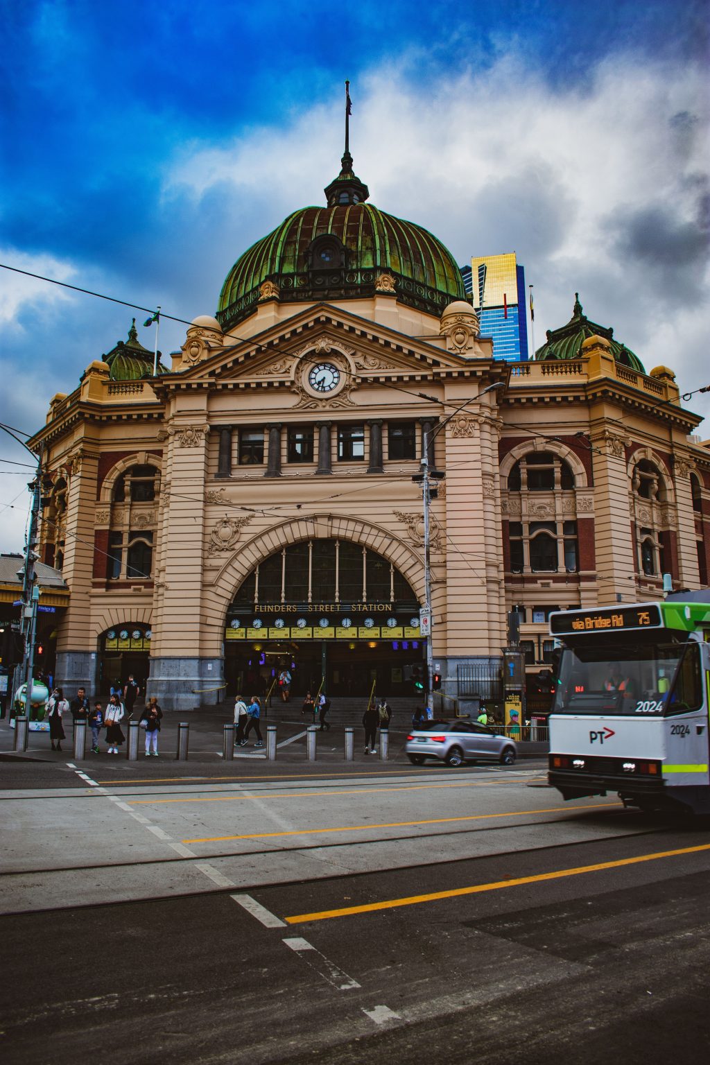 Flinders Street Station in Melbourne, known for its distinctive dome and vibrant architecture.